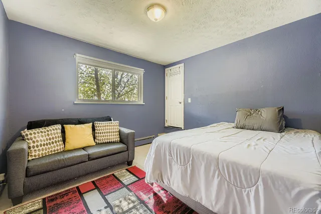 a bedroom with a bed and a cabinets