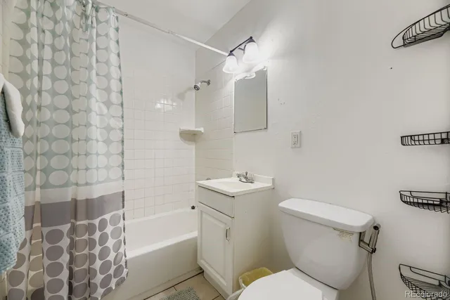 a bedroom with a bed and a chair