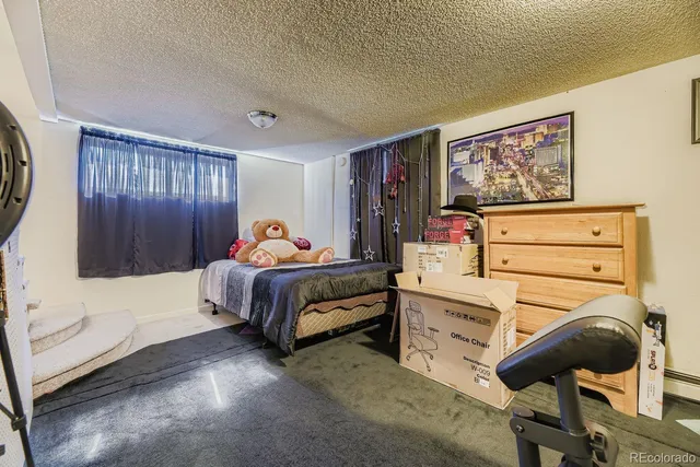 a kitchen with white cabinets and appliances