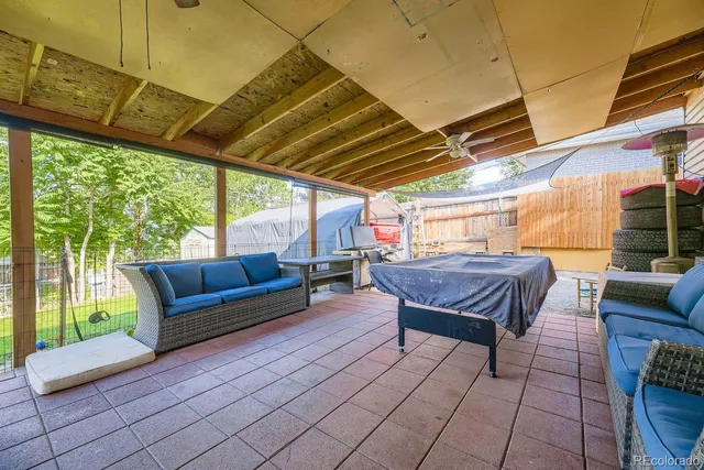 a view of a house with a yard porch and sitting area