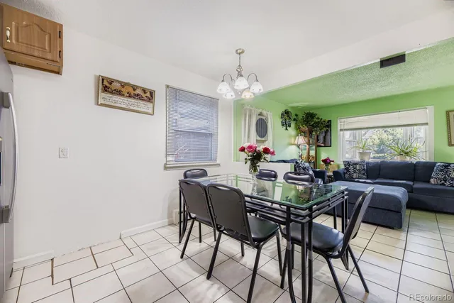 a living room with furniture and a table