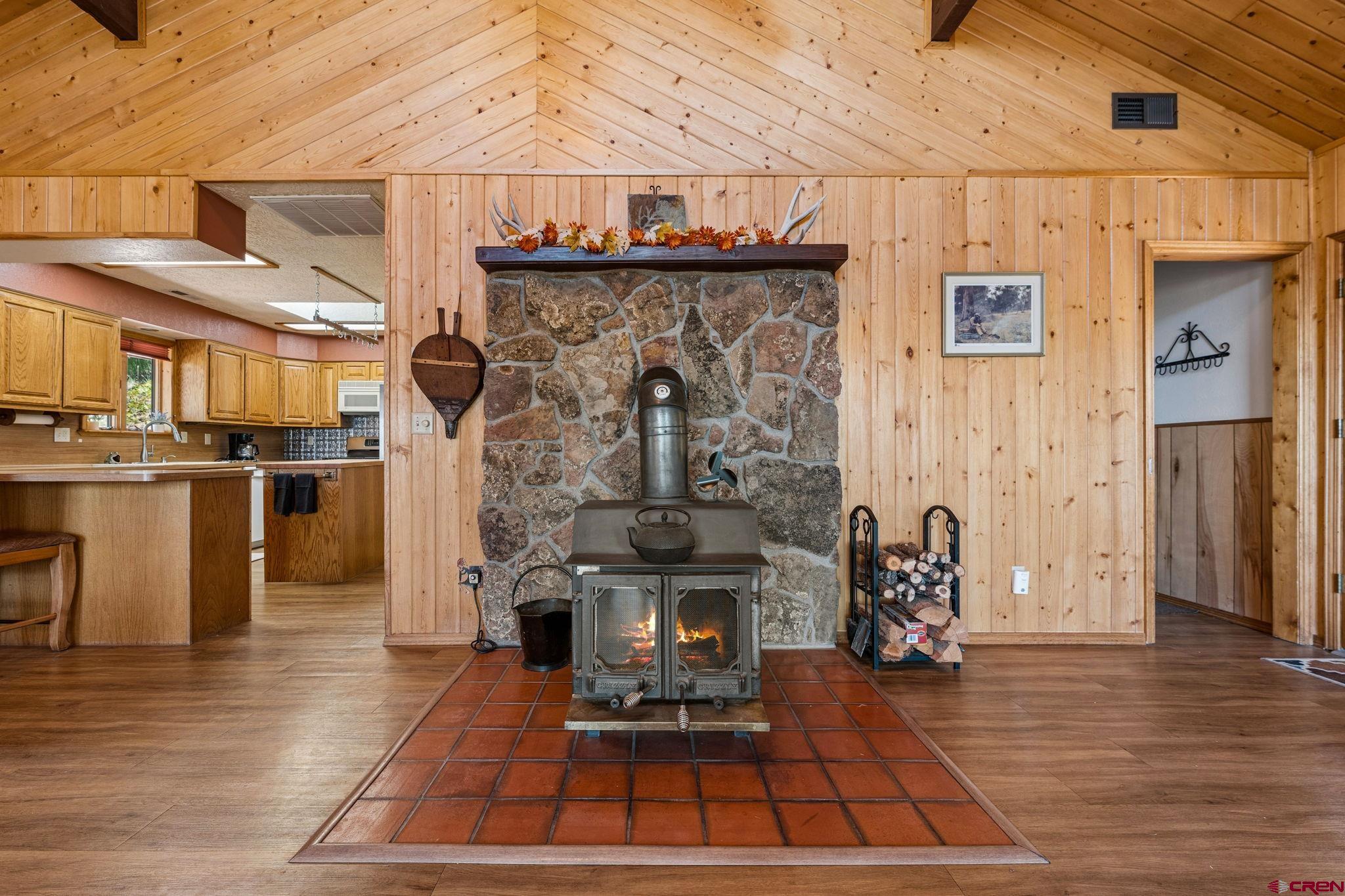 1024 Deer Ridge Drive Bayfield, CO 81122 - Photo 9 of 45 a living room with stainless steel appliances furniture a fireplace and a table
