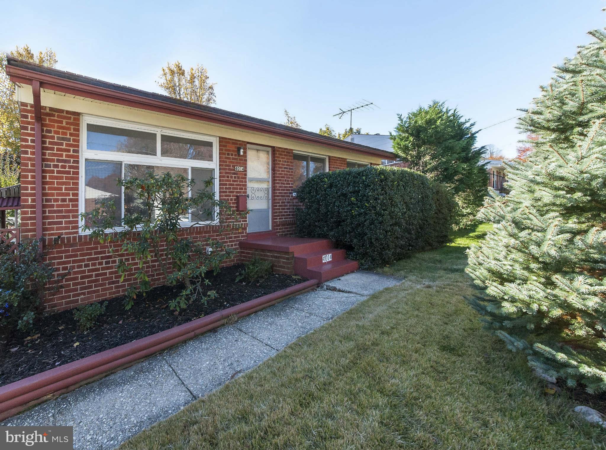 4014 Highview Drive Silver Spring, MD 20906 - Photo 1 of 22 a front view of a house with garden
