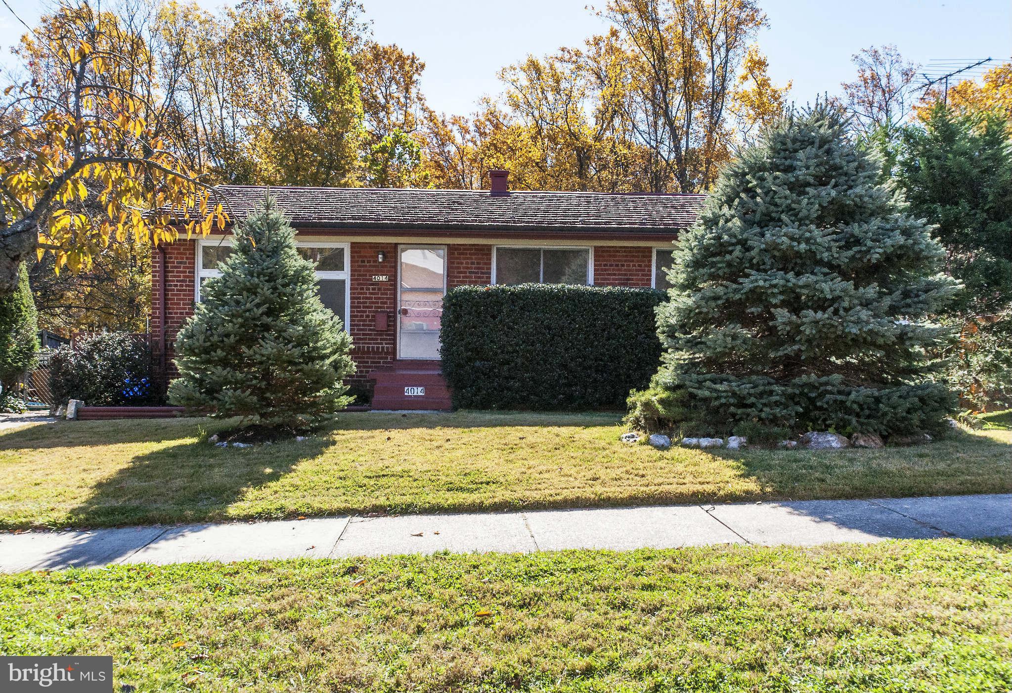 4014 Highview Drive Silver Spring, MD 20906 - Photo 2 of 22 a front view of a house with a yard