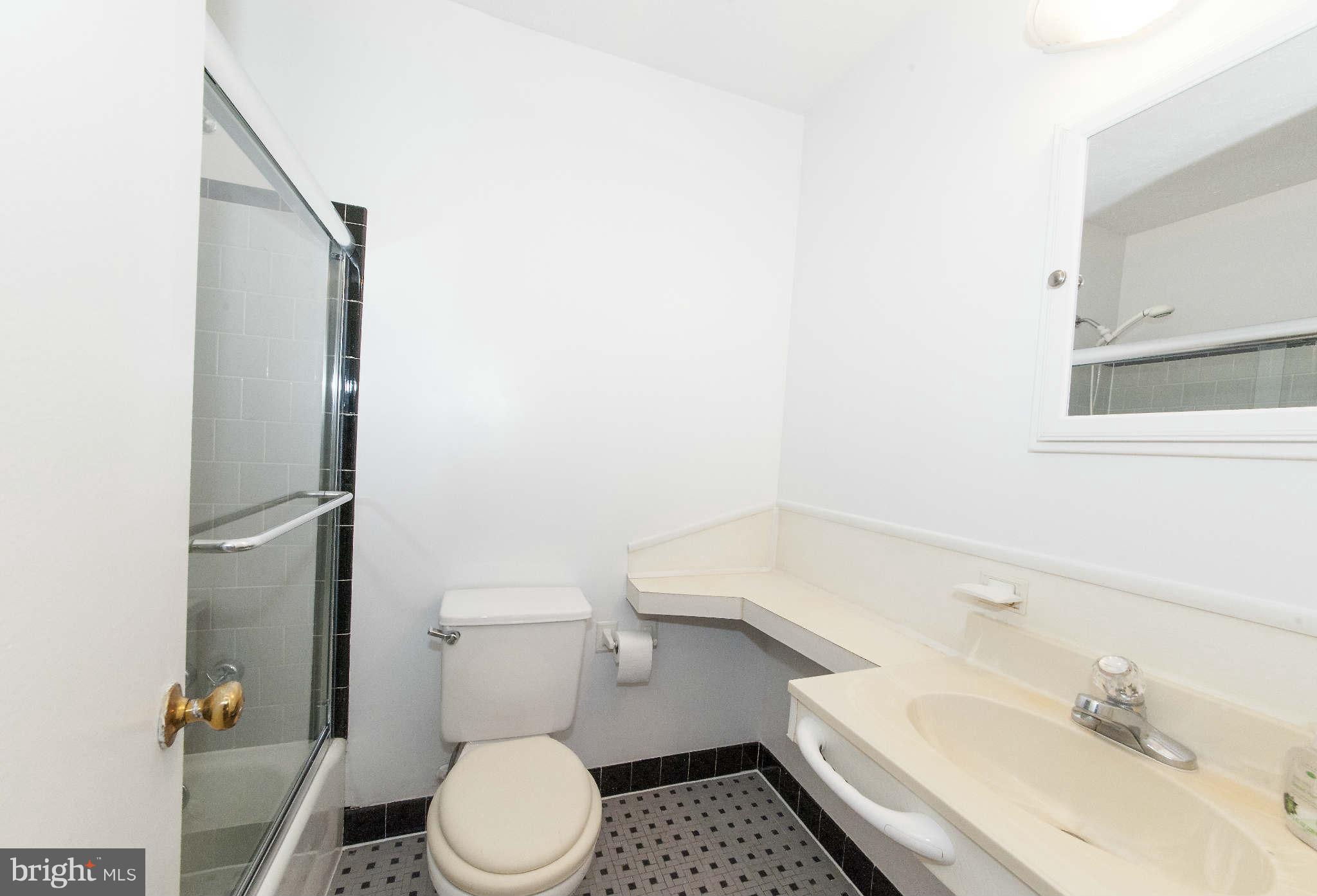 4014 Highview Drive Silver Spring, MD 20906 - Photo 11 of 22 a bathroom with a sink toilet and shower