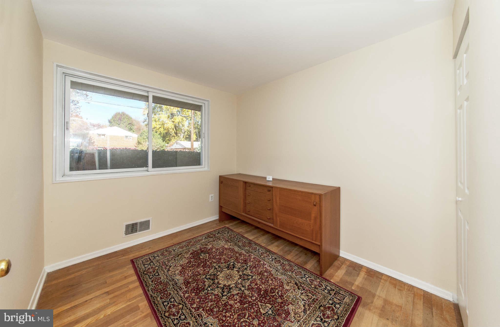 4014 Highview Drive Silver Spring, MD 20906 - Photo 12 of 22 a room with a bed and a window