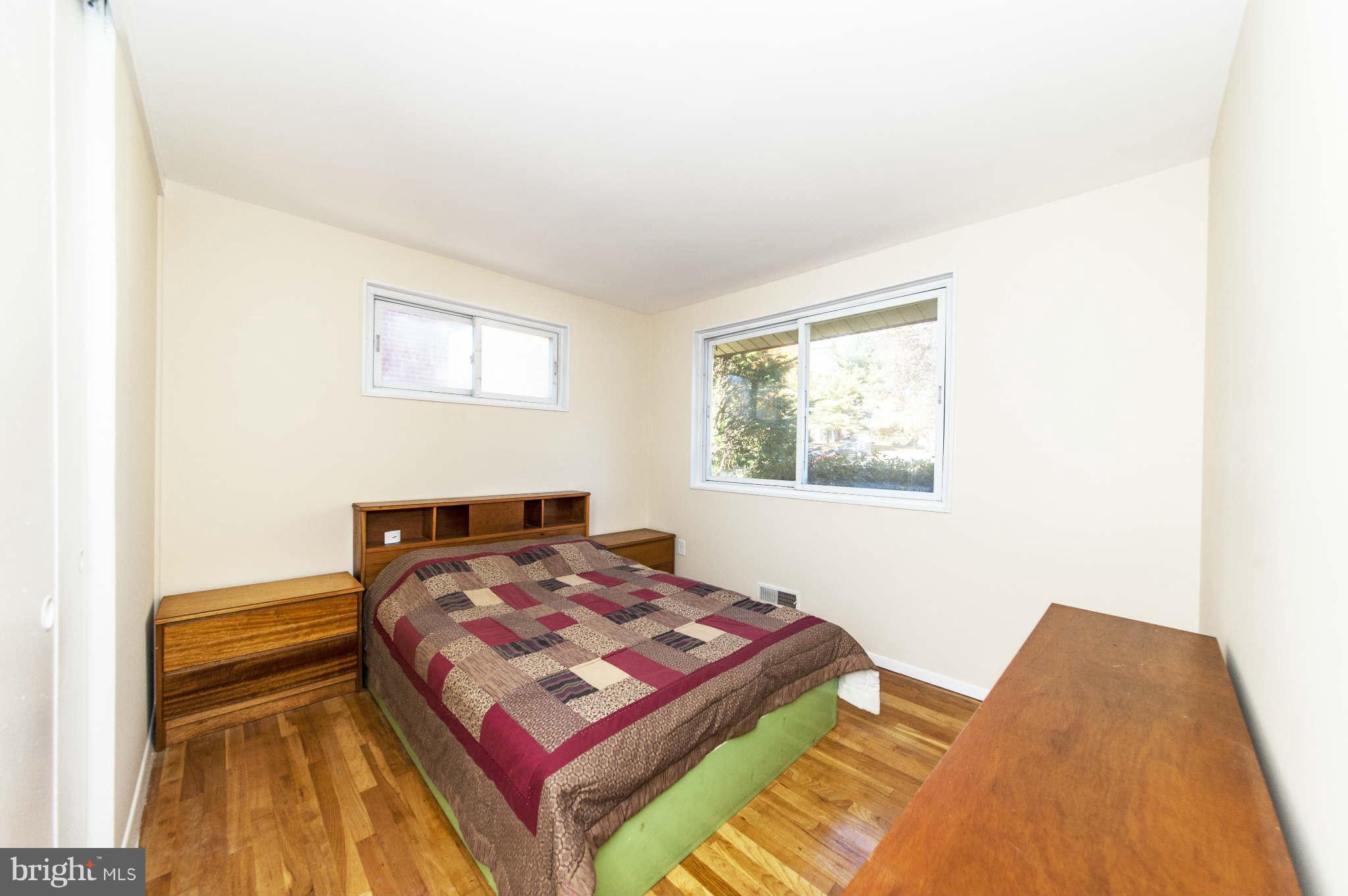 4014 Highview Drive Silver Spring, MD 20906 - Photo 13 of 22 a bedroom with a bed and a window