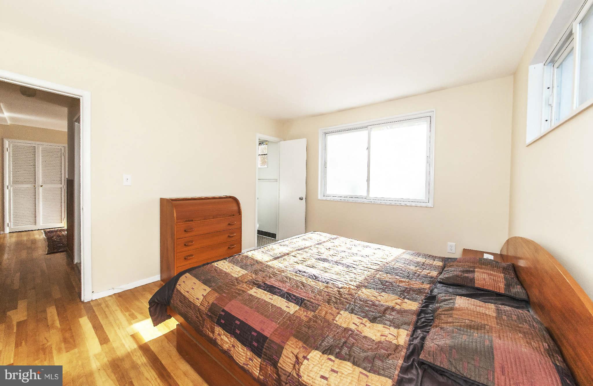 4014 Highview Drive Silver Spring, MD 20906 - Photo 14 of 22 a bedroom with a bed and wooden floor