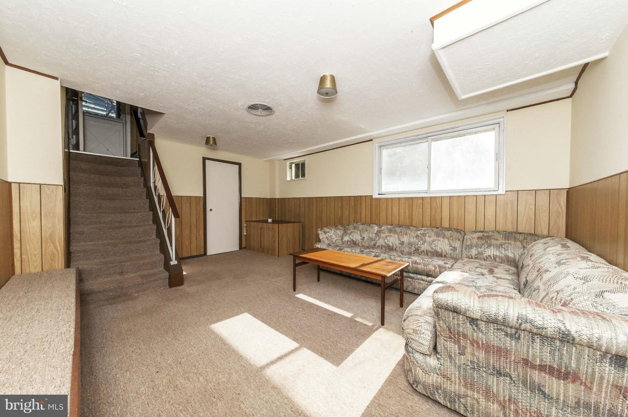 4014 Highview Drive Silver Spring, MD 20906 - Photo 16 of 22 a living room with a couch and a table