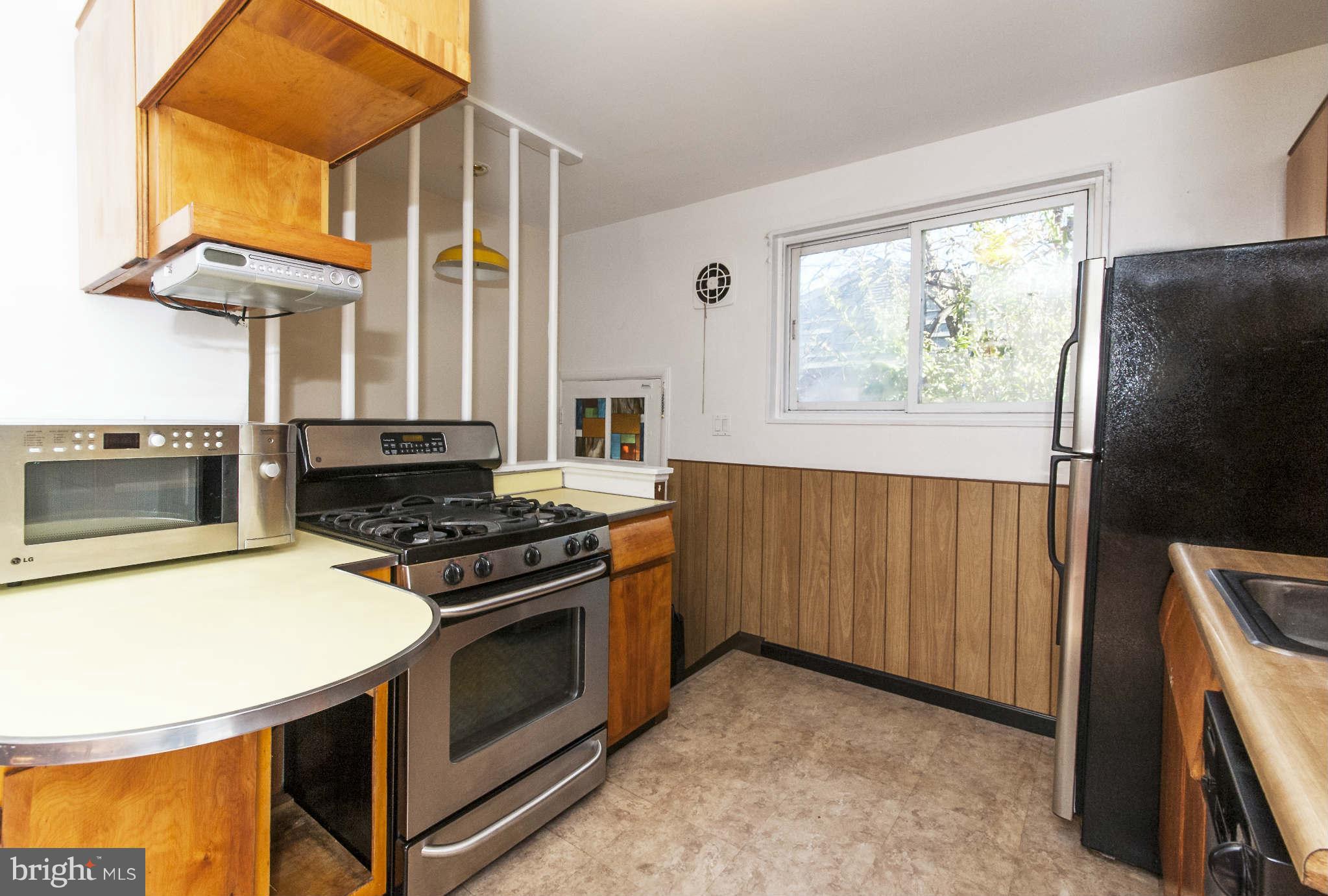 4014 Highview Drive Silver Spring, MD 20906 - Photo 9 of 22 a kitchen with stainless steel appliances granite countertop a stove a refrigerator and a stove