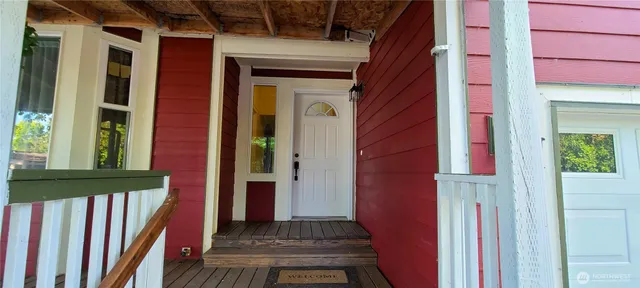 a view of a brick house with a large window