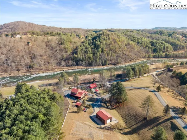 an aerial view of a house with a lake view