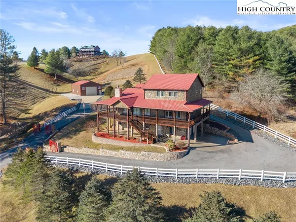 an aerial view of a house with swimming pool