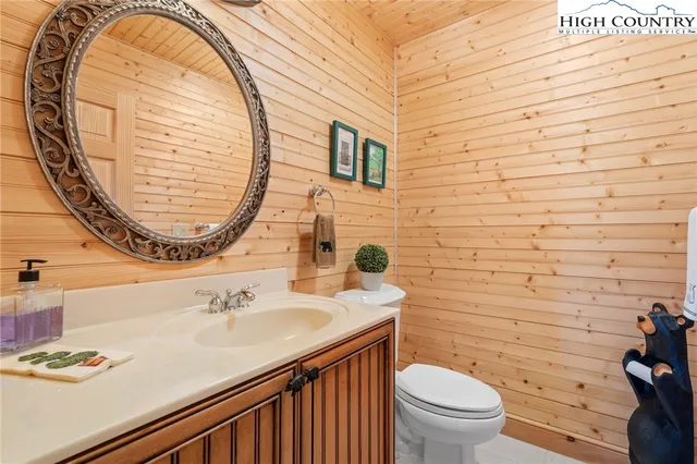 a bathroom with a sink a mirror and shower