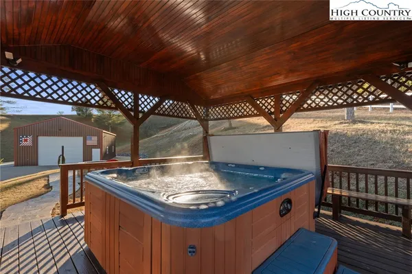 a backyard of a house with barbeque oven and outdoor seating