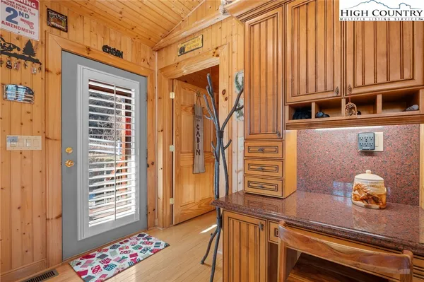 a kitchen with stainless steel appliances granite countertop a sink and cabinets