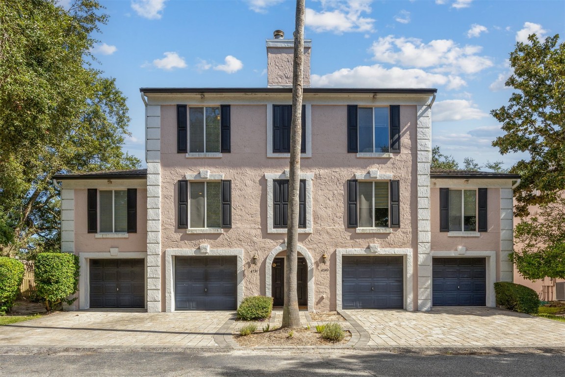 4734 Gulf Stream Court, Unit 9 Fernandina Beach, FL 32034 - Photo 1 of 32 a front view of a house with a yard