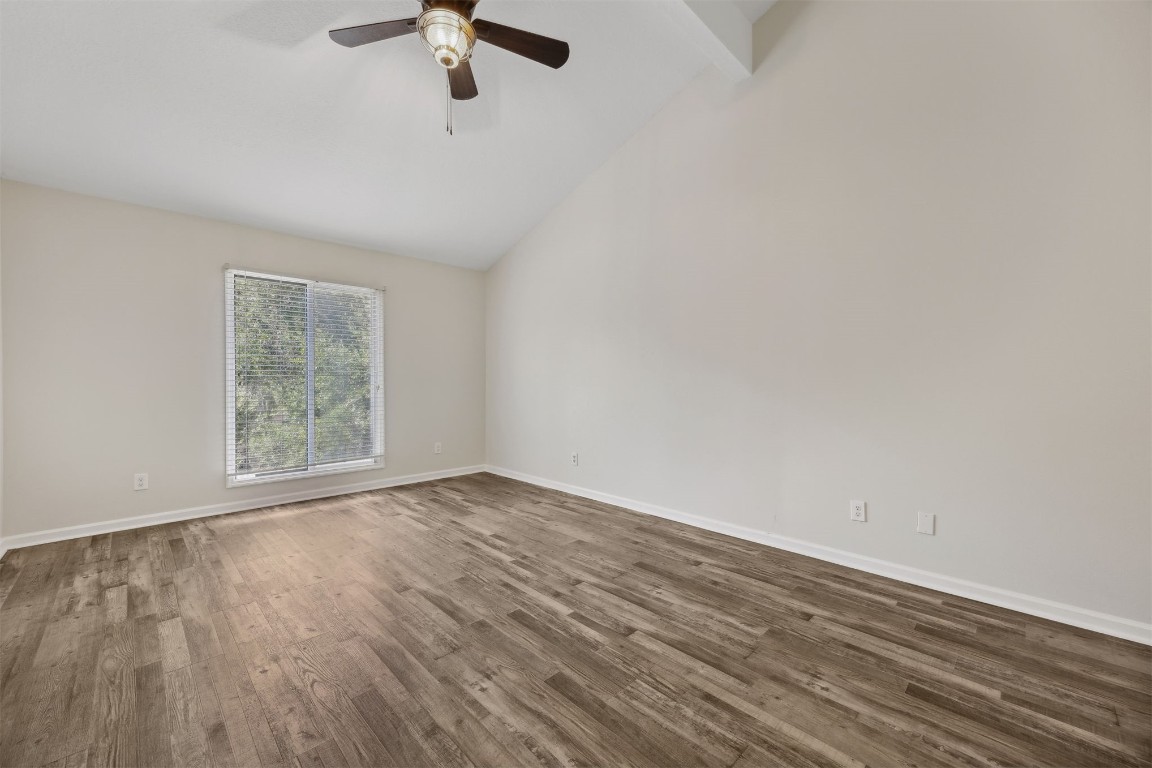 4734 Gulf Stream Court, Unit 9 Fernandina Beach, FL 32034 - Photo 16 of 32 wooden floor in an empty room with a window