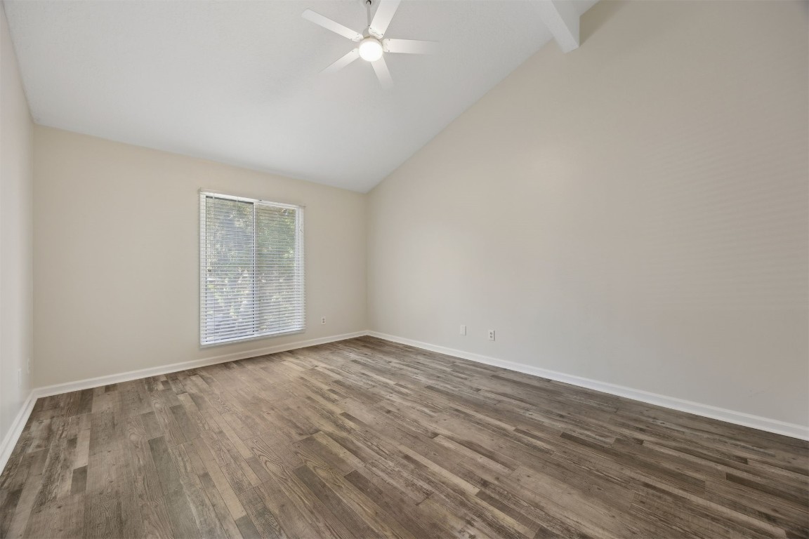 4734 Gulf Stream Court, Unit 9 Fernandina Beach, FL 32034 - Photo 22 of 32 a view of an empty room with wooden floor and a window