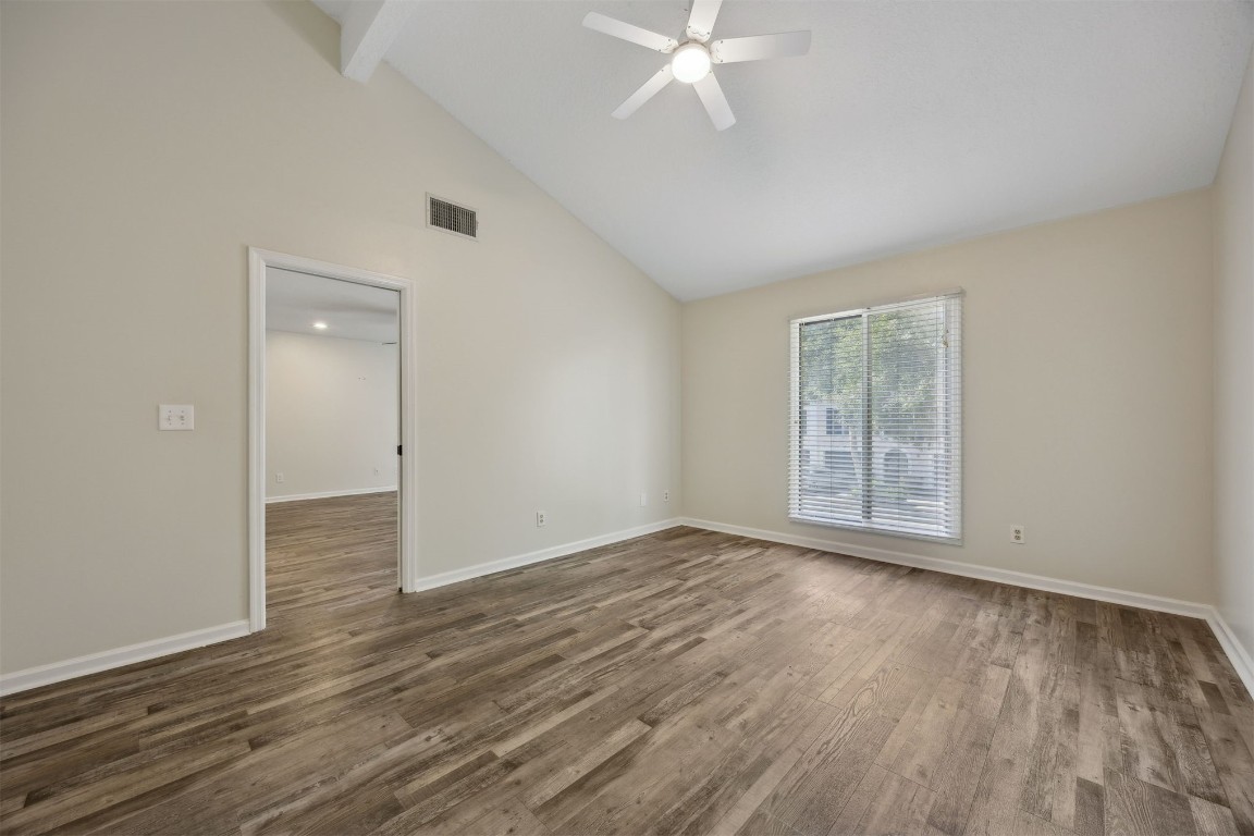 4734 Gulf Stream Court, Unit 9 Fernandina Beach, FL 32034 - Photo 24 of 32 an empty room with wooden floor and windows