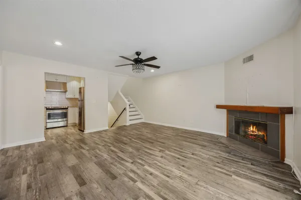 a kitchen with stainless steel appliances white cabinets and a stove