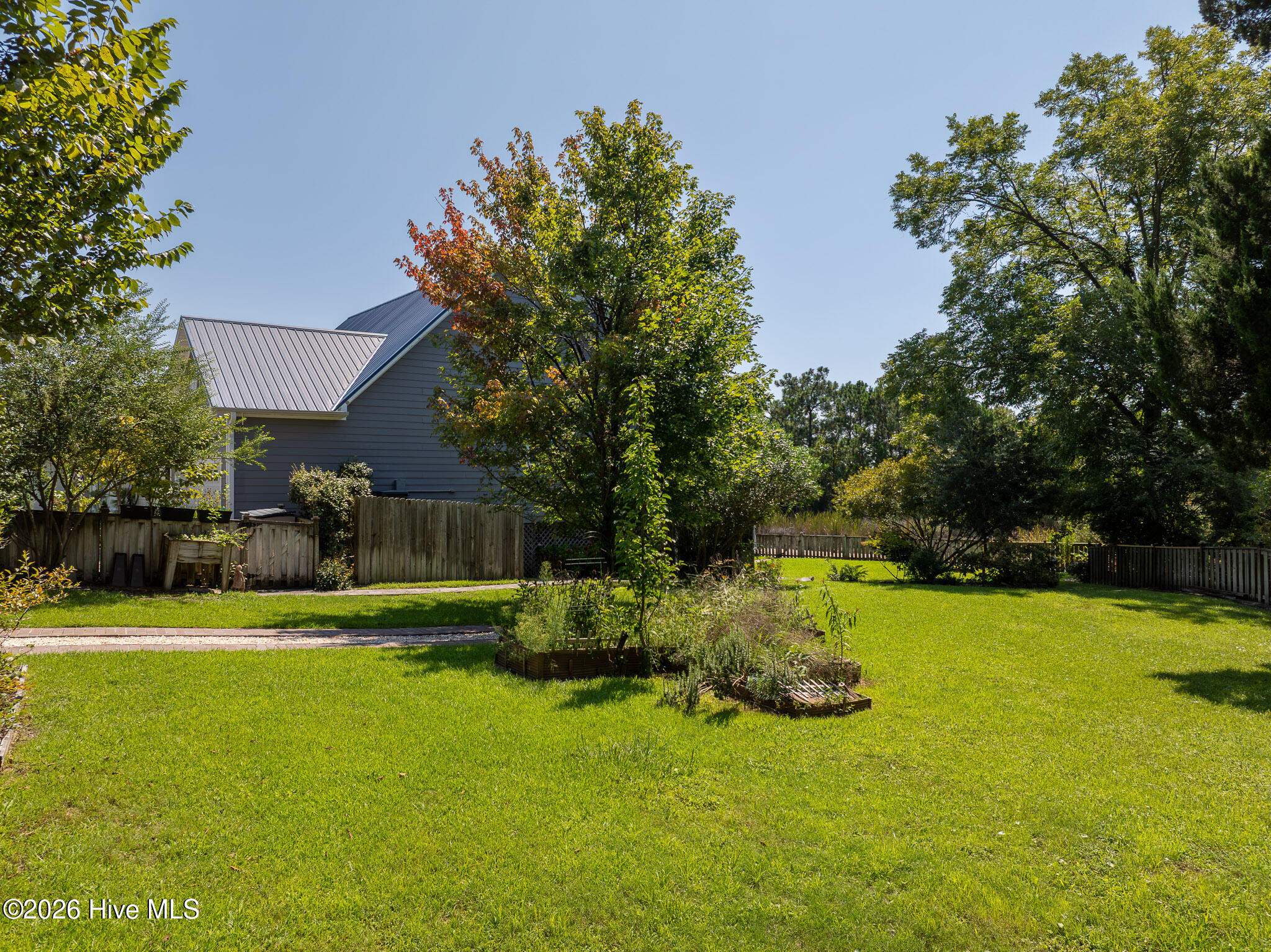 House is on a double lot. There is a pad for parking boat/trailer/rv with double-gate entry