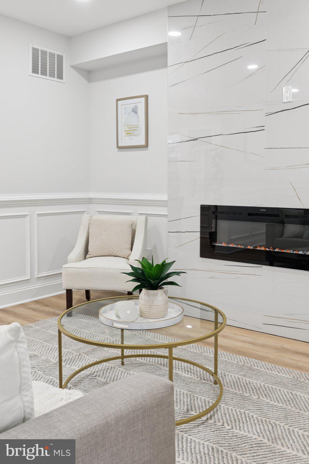 125 West Summit Avenue Haddonfield, NJ 08033 - Photo 11 of 68 a living room with a couch and a potted plant