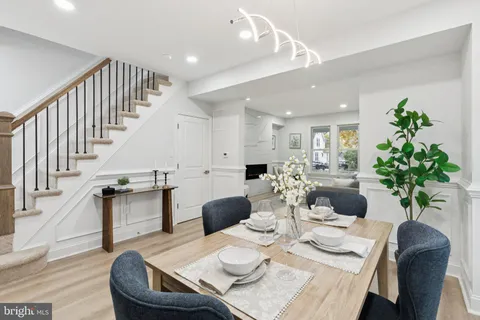 a kitchen with a sink a table and chair