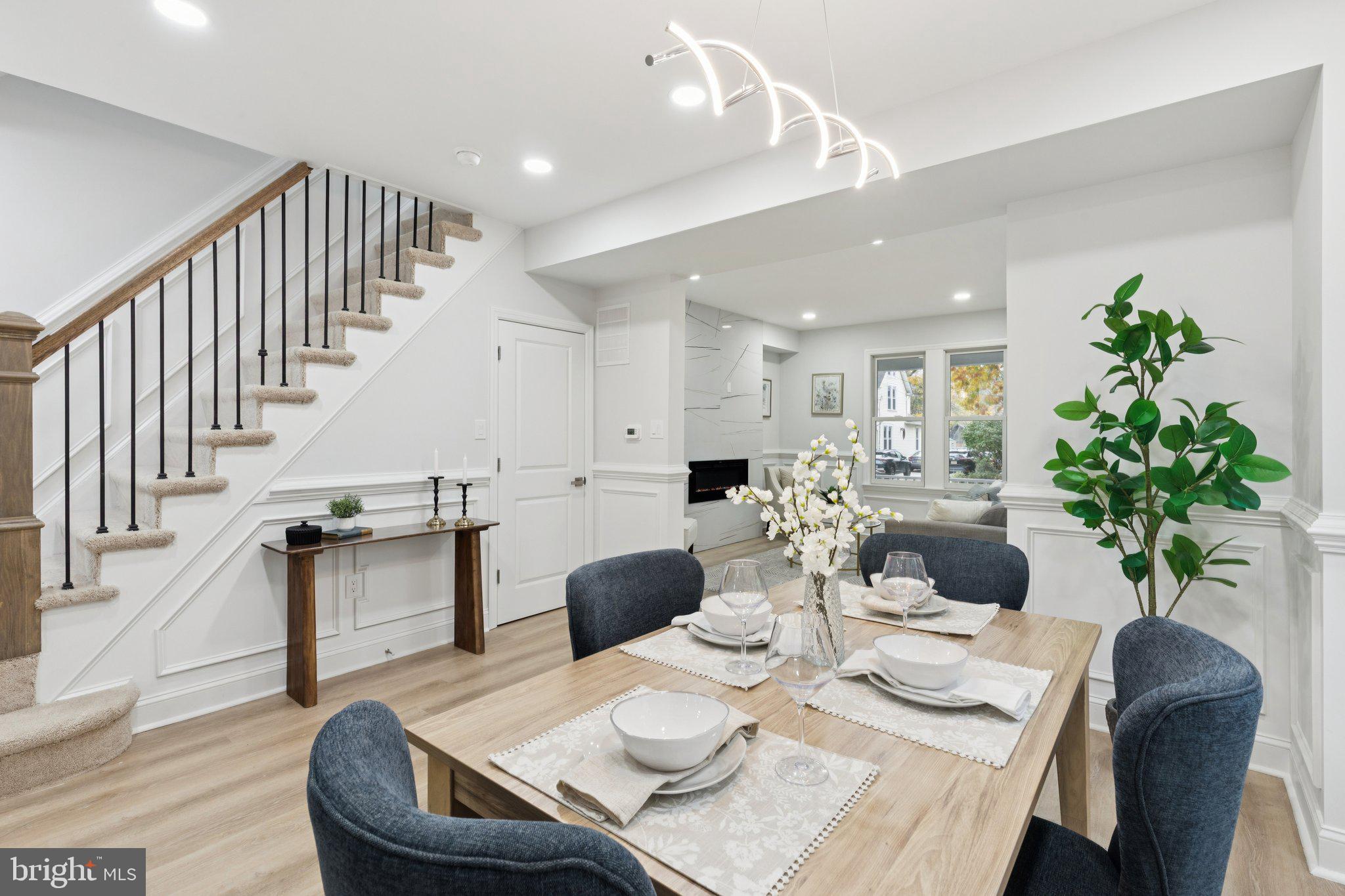 125 West Summit Avenue Haddonfield, NJ 08033 - Photo 17 of 68 a view of a dining room with furniture a potted plant and wooden floor
