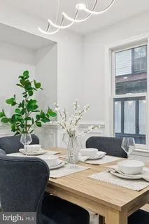 a kitchen with stainless steel appliances granite countertop a refrigerator a sink dishwasher a stove top oven a refrigerator and cabinets