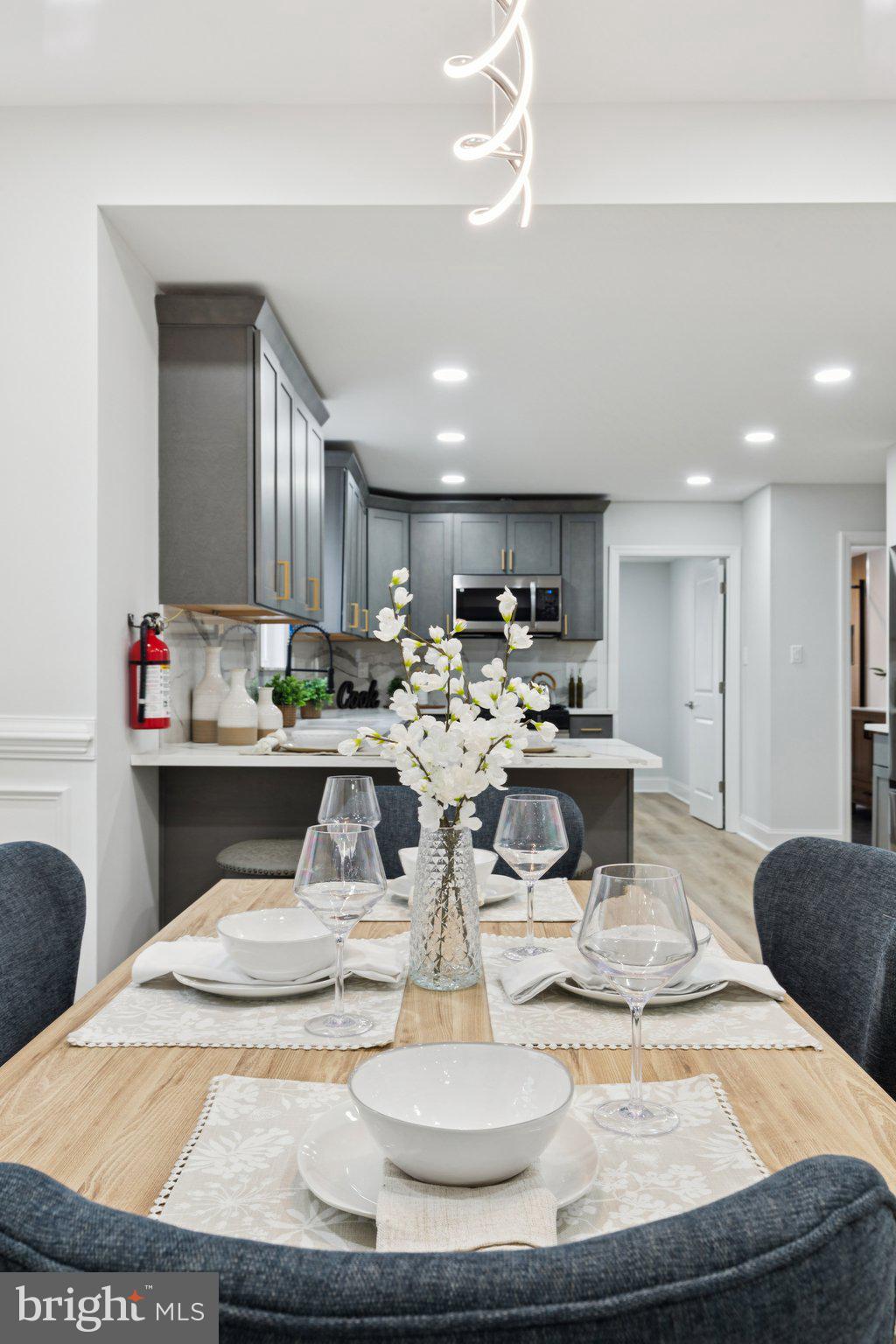 125 West Summit Avenue Haddonfield, NJ 08033 - Photo 19 of 68 a kitchen with stainless steel appliances kitchen island granite countertop a sink and a stove