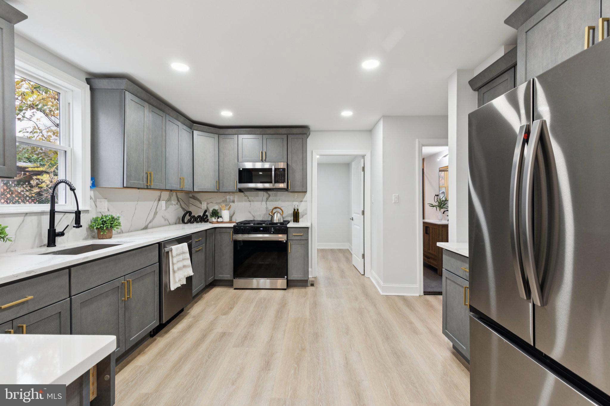 125 West Summit Avenue Haddonfield, NJ 08033 - Photo 22 of 68 a kitchen with stainless steel appliances granite countertop a refrigerator a sink dishwasher a stove top oven a refrigerator and cabinets