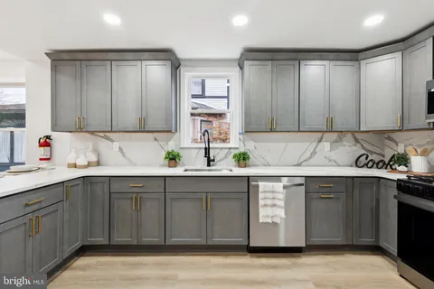 a bathroom with a shower and a sink