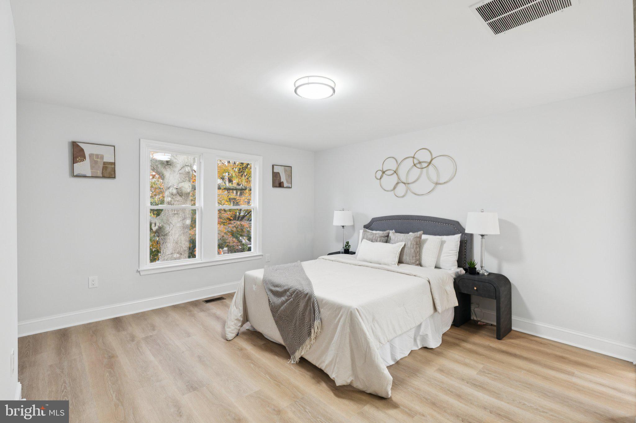 125 West Summit Avenue Haddonfield, NJ 08033 - Photo 32 of 68 a bedroom with a bed and a window