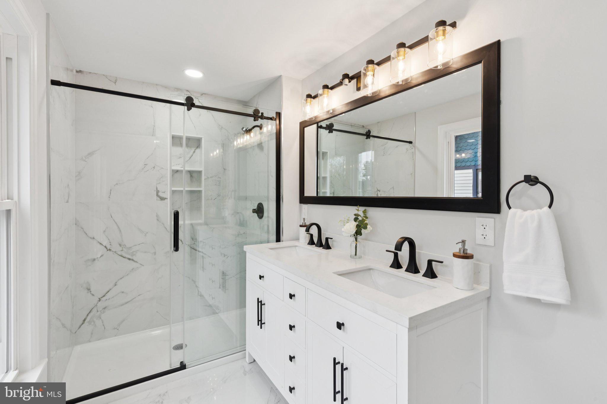 125 West Summit Avenue Haddonfield, NJ 08033 - Photo 37 of 68 a bathroom with a sink vanity and mirror