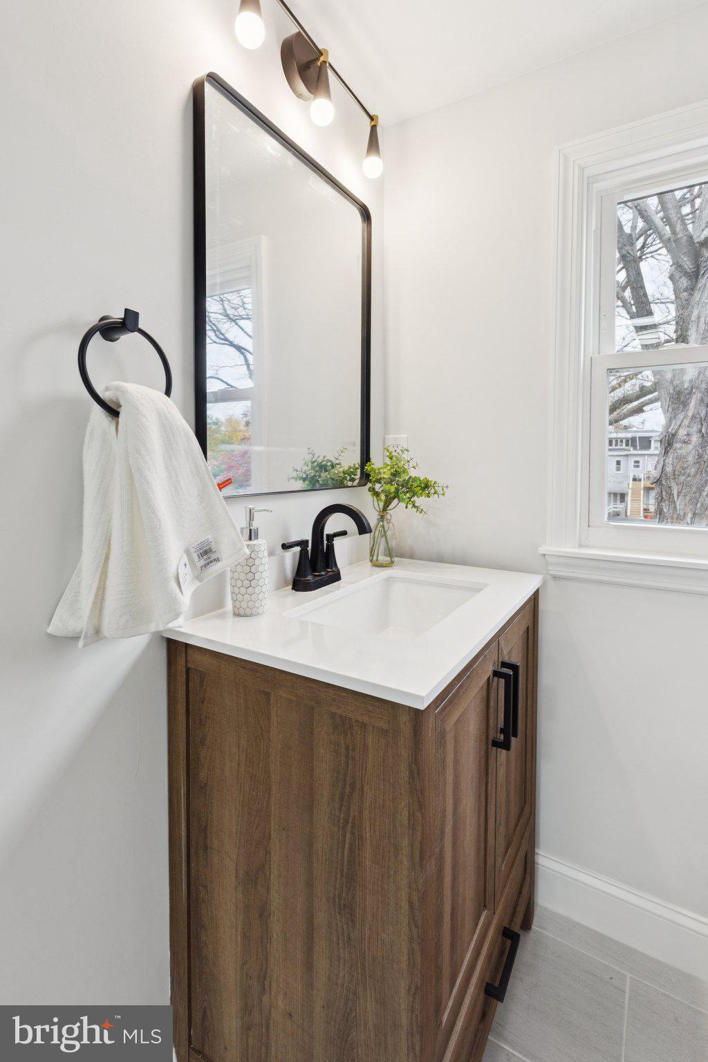 125 West Summit Avenue Haddonfield, NJ 08033 - Photo 44 of 68 a bathroom with a sink and a mirror