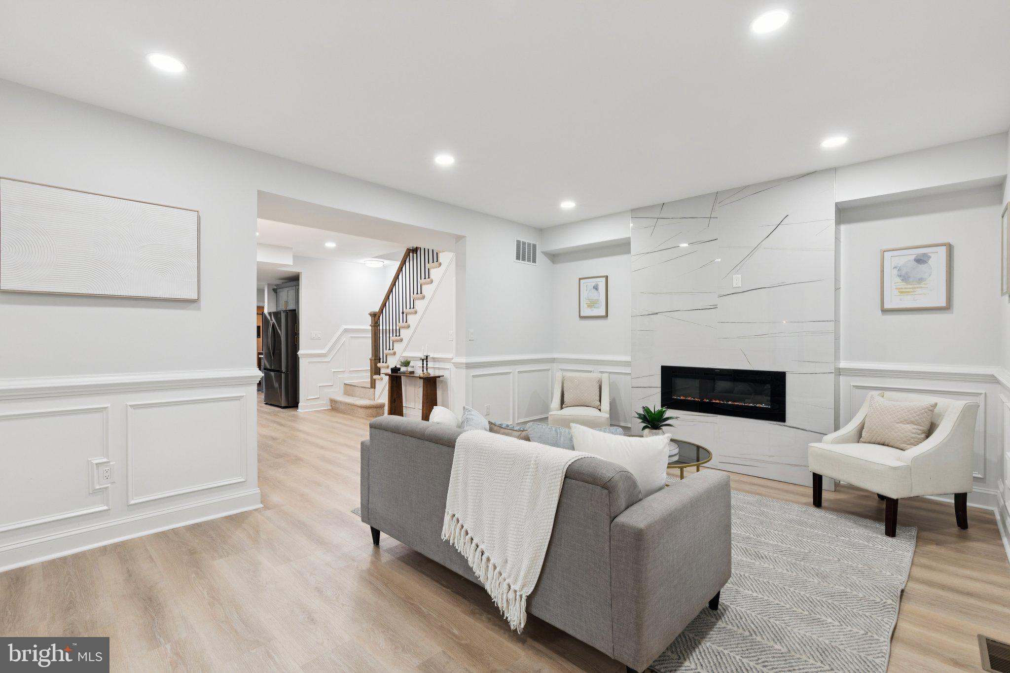 125 West Summit Avenue Haddonfield, NJ 08033 - Photo 5 of 68 a living room with furniture and a fireplace