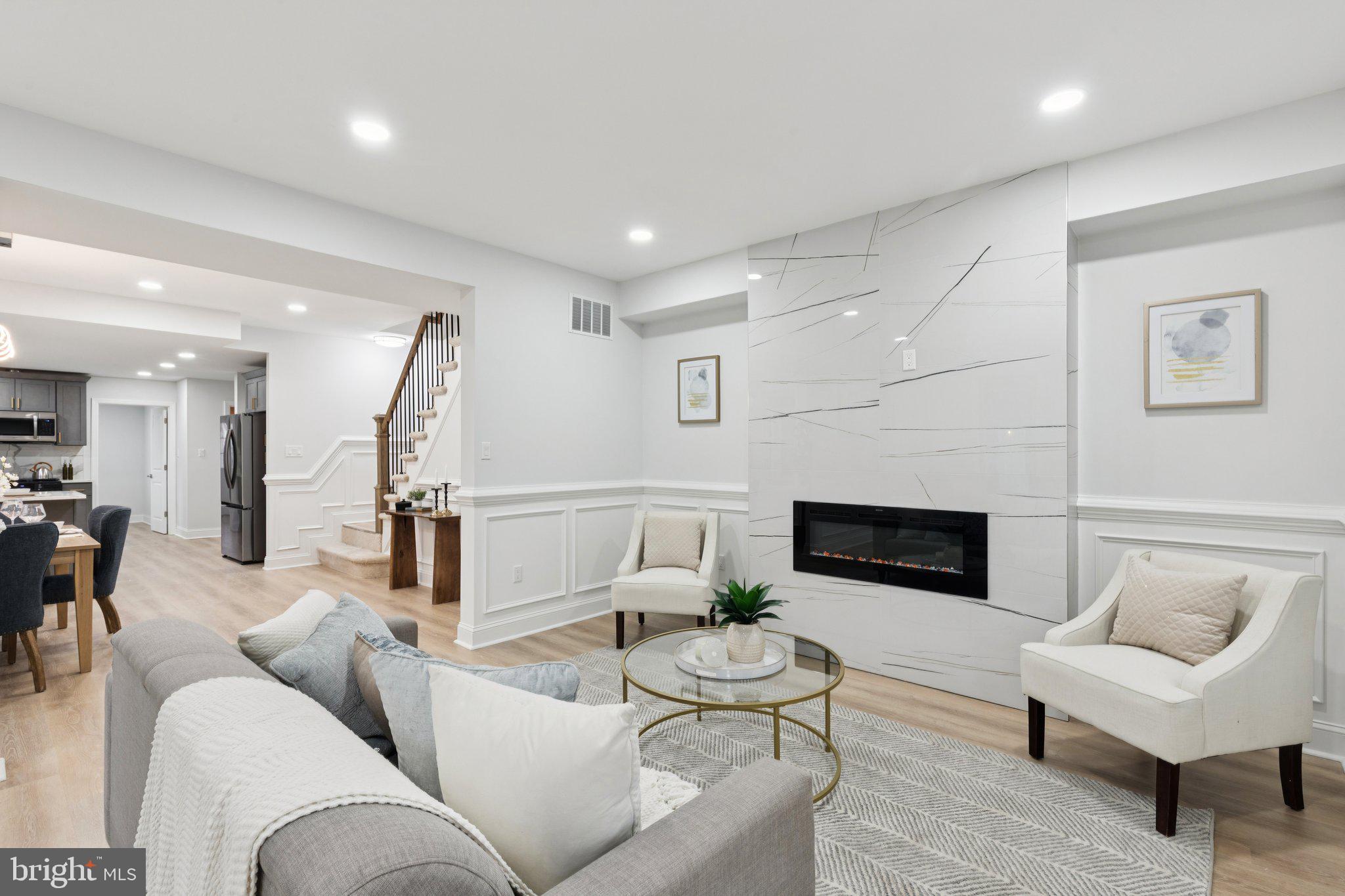 125 West Summit Avenue Haddonfield, NJ 08033 - Photo 6 of 68 a living room with furniture and a fireplace
