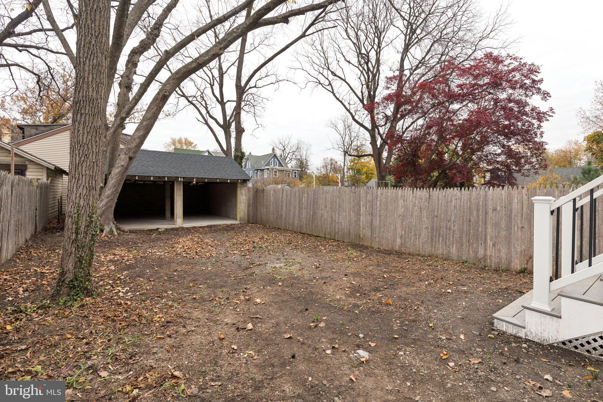 125 West Summit Avenue Haddonfield, NJ 08033 - Photo 67 of 68 a view of a house with a large tree and wooden fence
