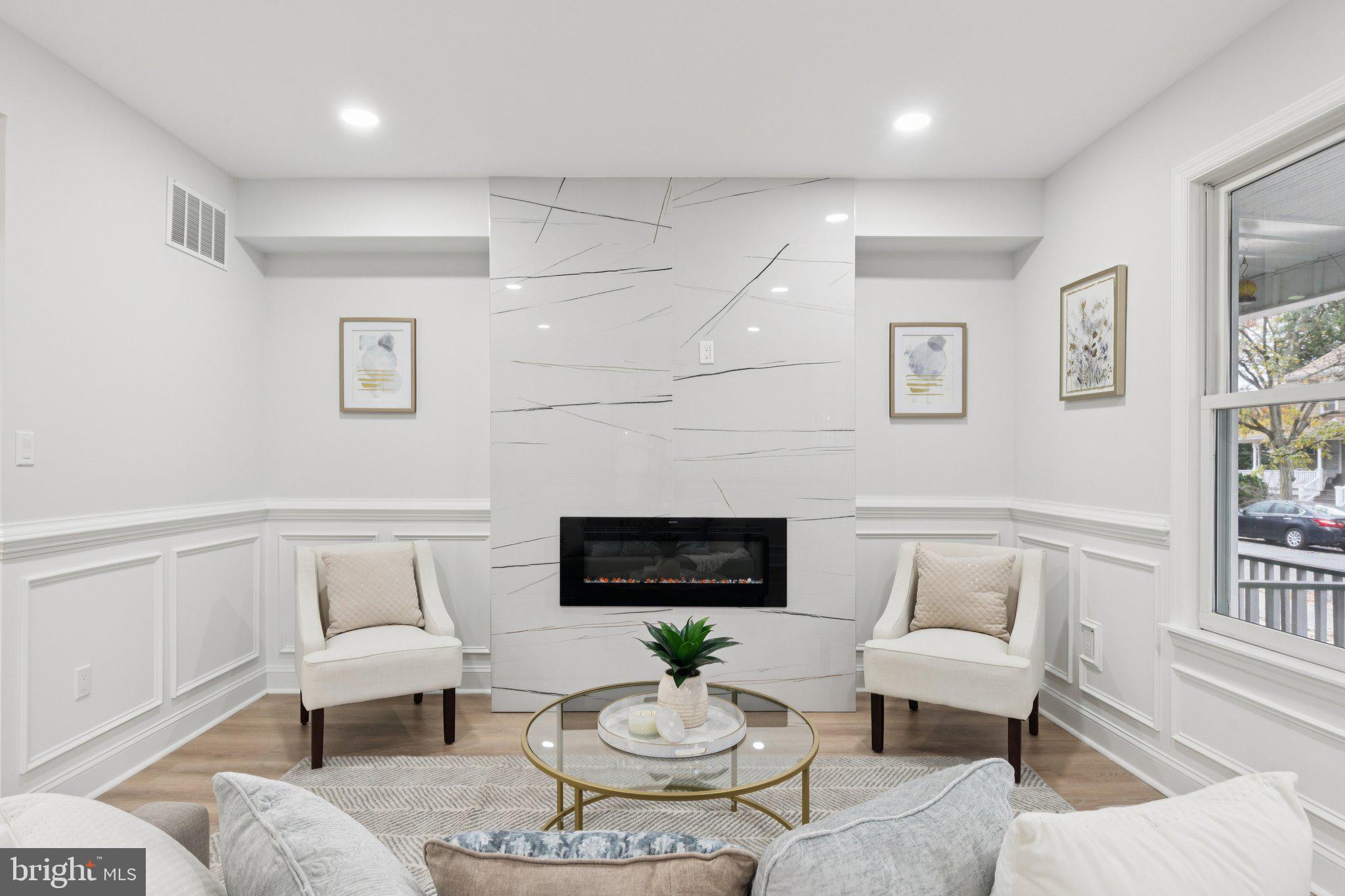 125 West Summit Avenue Haddonfield, NJ 08033 - Photo 7 of 68 a living room with furniture a rug and a fireplace