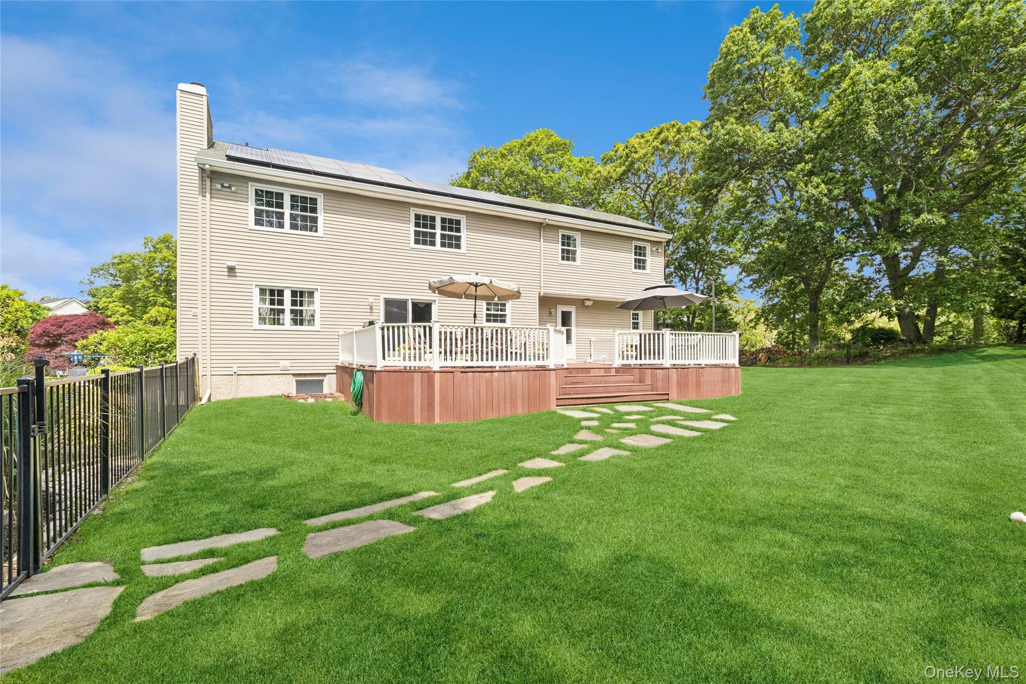 42 Adelia Path Riverhead, NY 11901 - Photo 24 of 30 View of the back by the tree house