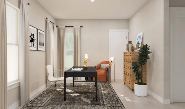 a living room with furniture and a potted plant