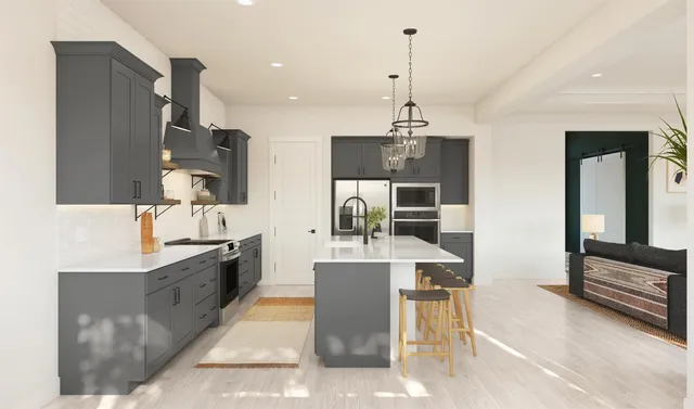 a large kitchen with kitchen island a large counter top space appliances and cabinets