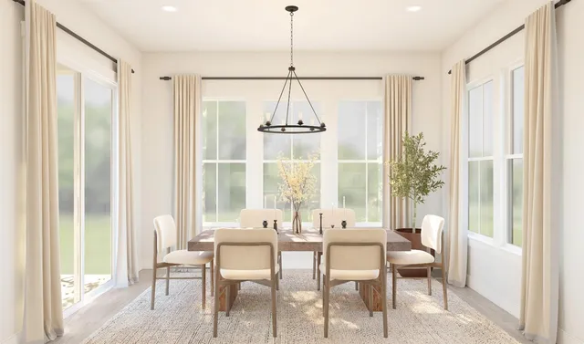 a dining room with wooden floor a chandelier a glass table and chairs
