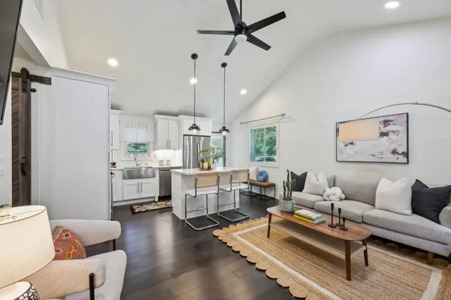a living room with furniture and a table
