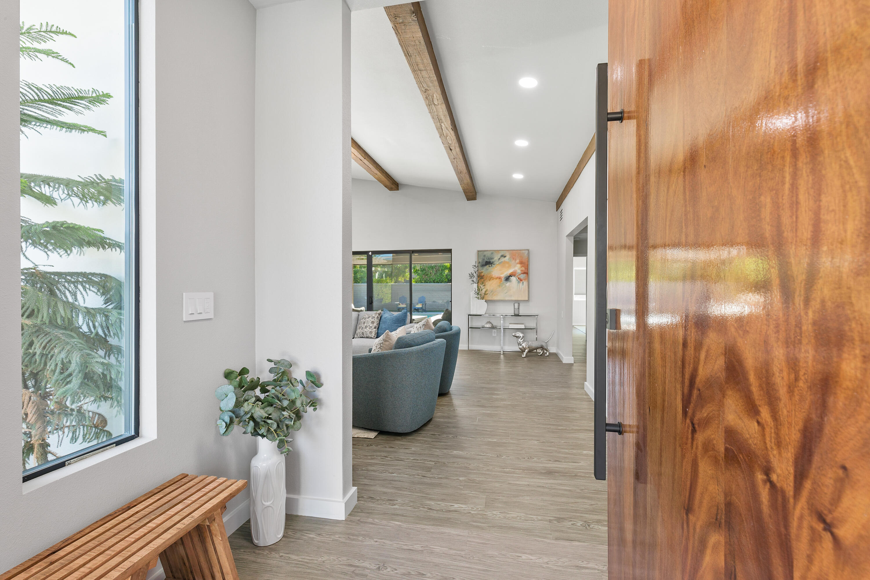 74155 Mockingbird Trail Indian Wells, CA 92210 - Photo 14 of 55 a living room with furniture and a potted plant