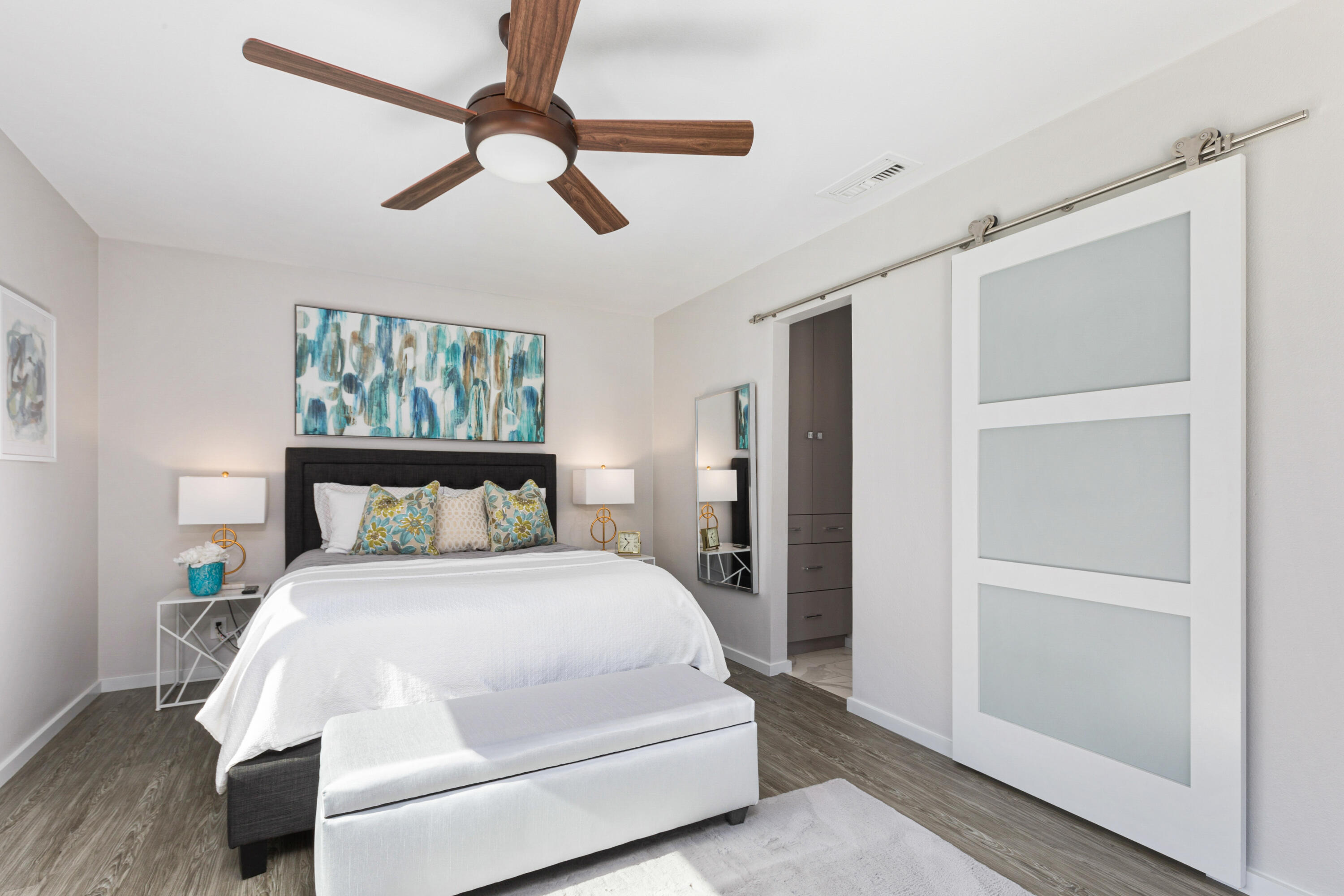 74155 Mockingbird Trail Indian Wells, CA 92210 - Photo 24 of 55 a bedroom with a bed and a chandelier