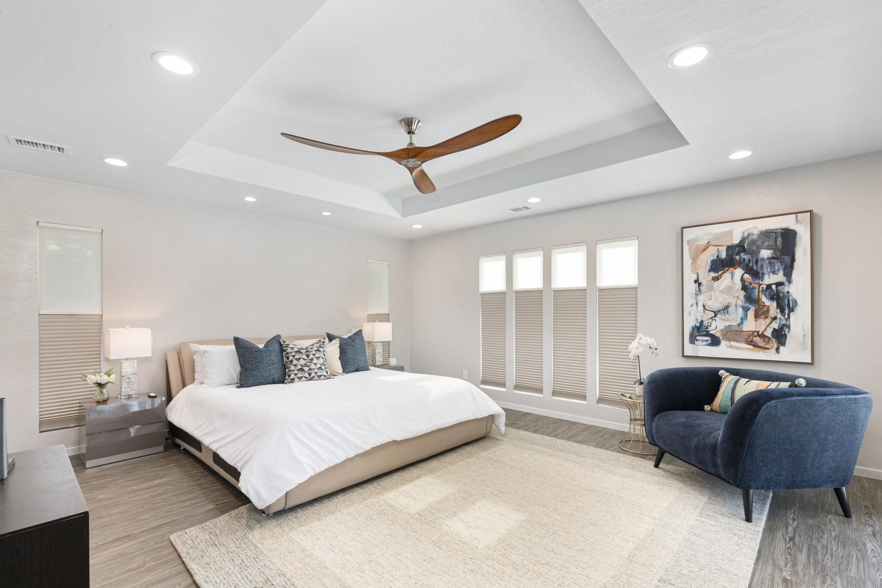 74155 Mockingbird Trail Indian Wells, CA 92210 - Photo 27 of 55 a bedroom with a large bed a couch and a large window