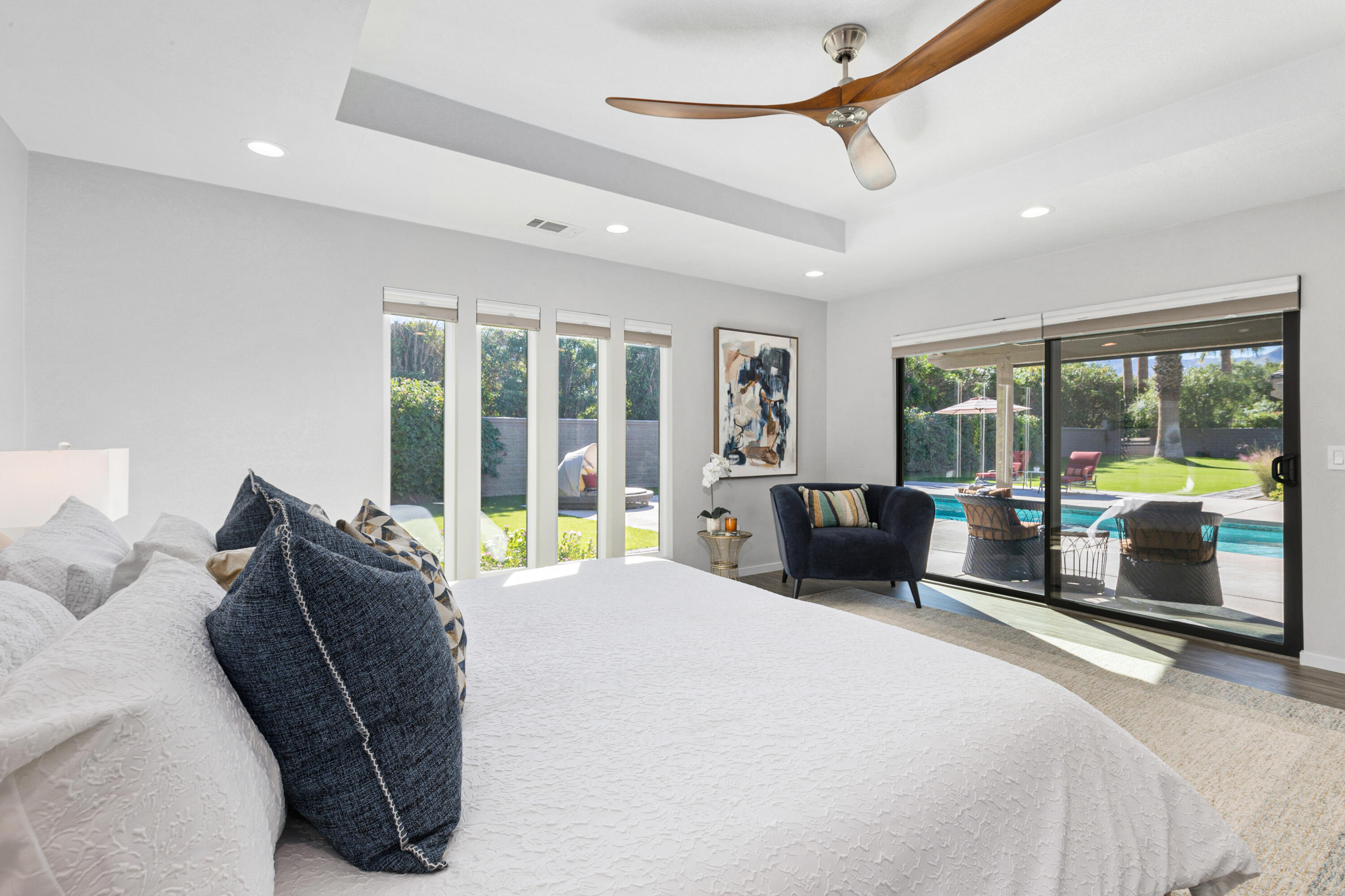 74155 Mockingbird Trail Indian Wells, CA 92210 - Photo 29 of 55 a bedroom with a bed and glass walk in closet