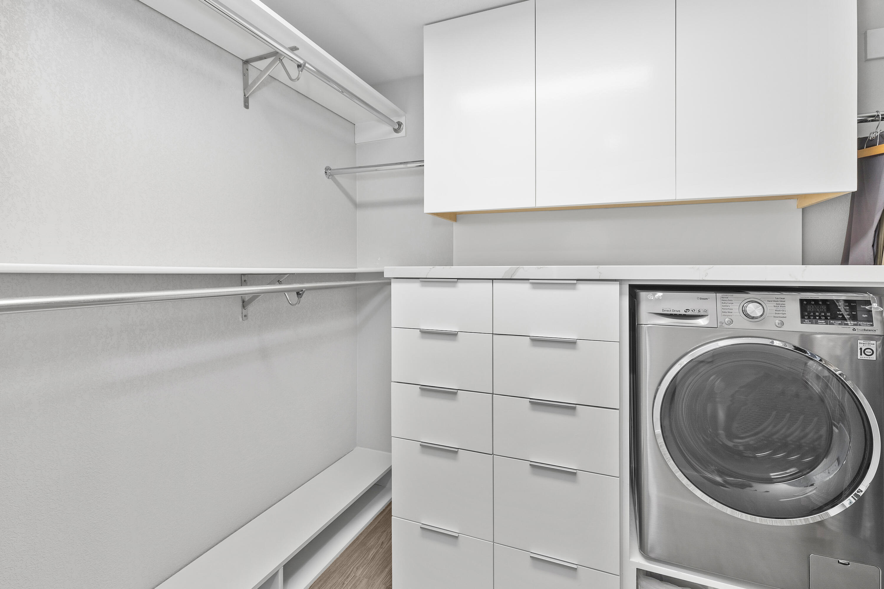 74155 Mockingbird Trail Indian Wells, CA 92210 - Photo 32 of 55 a utility room with cabinets and washer